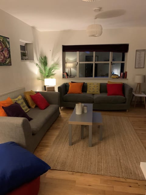 Lounge with two patio doors.  Smart TV