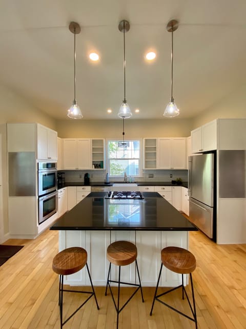 Kitchen - Shaker cabinets, Black Granite, Stainless, Double Ovens, Gas Stove.