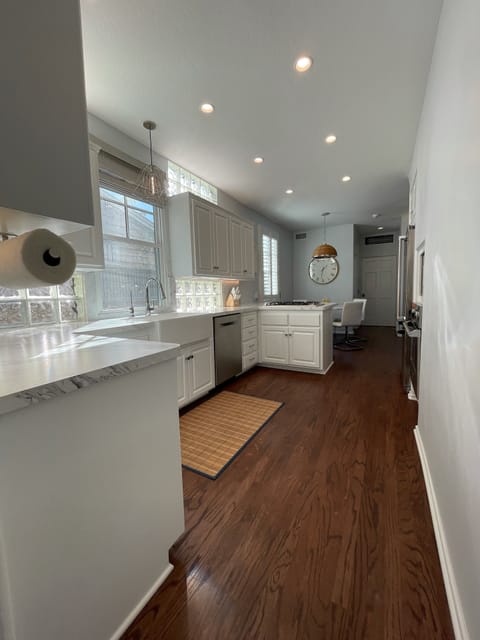 View of galley kitchen with Viking and Bosch appliances 
