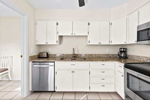 Effortless style and function meet here—sleek counters and upscale appliances inspire culinary creativity.