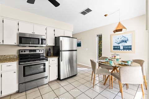 Natural light floods this space, making every meal prep a joy and every snack a celebration.
