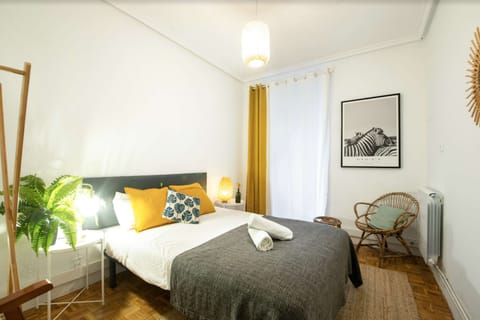 Bedroom with double bed and balcony