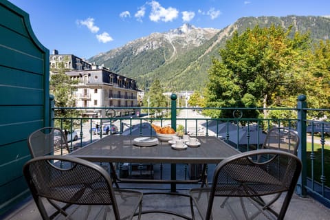 Balcony with outdoor furniture and mountain views
