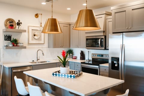 Fully equipped kitchen with stainless appliances and spacious island — perfect for family meals