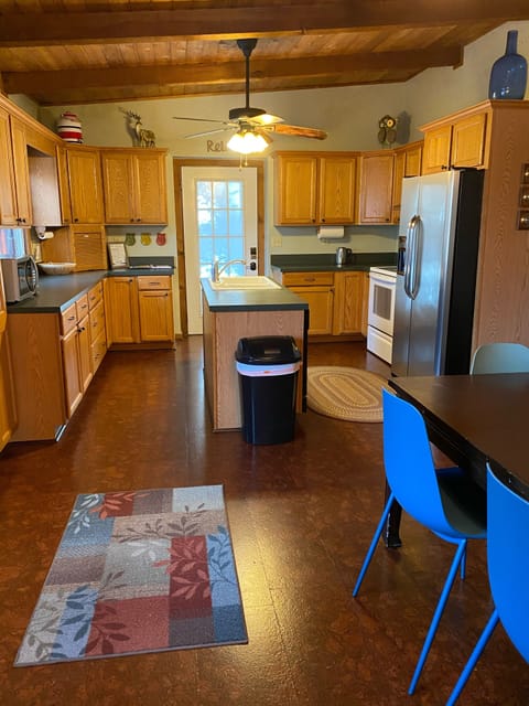 Well stocked kitchen with dining table that seats 8.