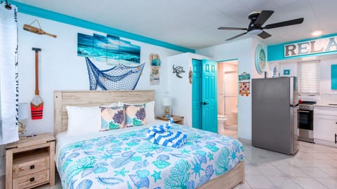 Experience the nostalgic charm of low-rise "Old Florida" in this cozy beach-themed ground-floor studio.