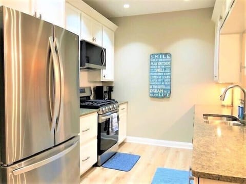 Kitchen - Brightly lit kitchen with all new appliances