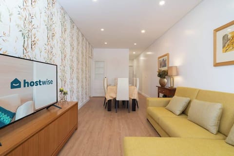 The living room has one AC and a spacious couch to relax while you watch TV.