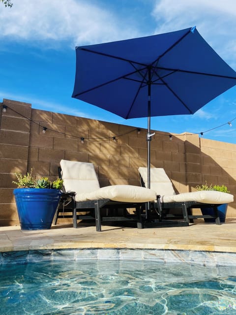 2 sets of loungers.  Both have umbrellas for some shade.