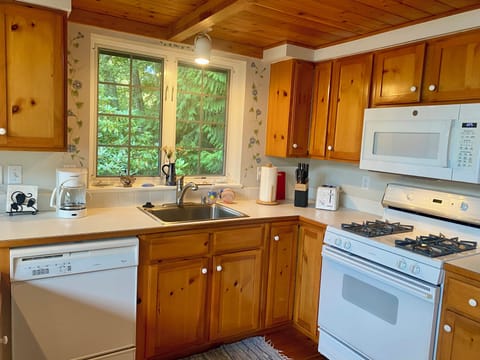 There is a gas stove, built in microwave, toaster, coffee maker and dishwasher!