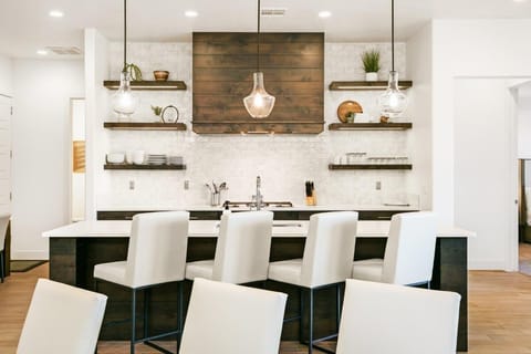 Deluxe kitchen stocked with appliances and utensils