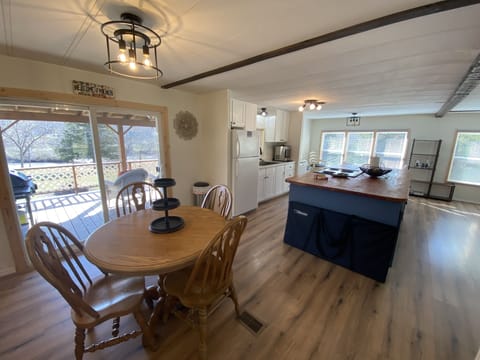 Second dining room table with view out to deck and lake. 