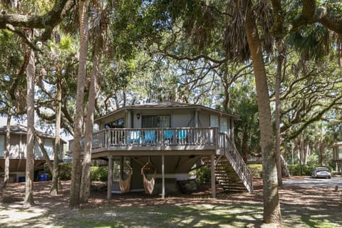Unique elevated treehouse nestled beneath majestic live oaks
