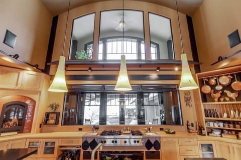 Pendant lights over the kitchen granite.