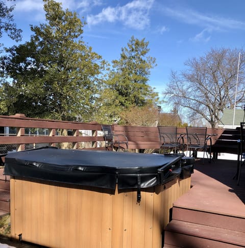 The hot tub and large deck are off the back of the house.