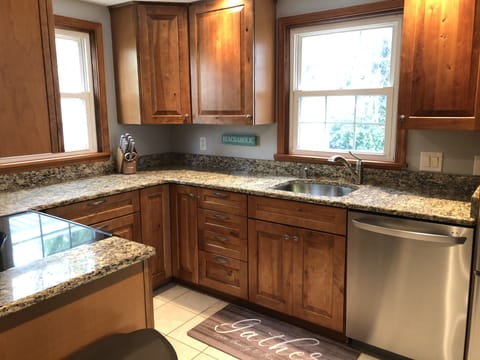 Cozy kitchen has a microwave, oven, refrigerator/freezer, ice maker, dishwasher.