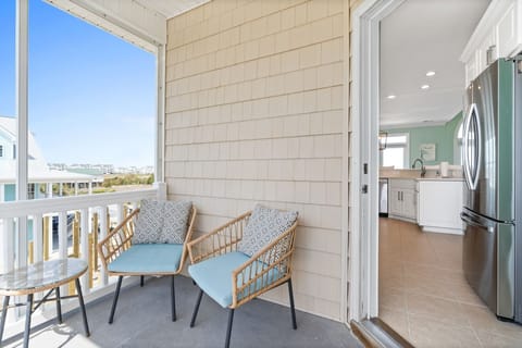 Covered porch seating off of the kitchen