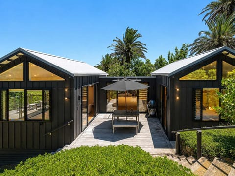 This pavilion home opens up to a central courtyard with BBQ and outdoor dining