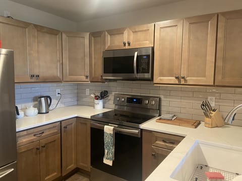 Brand new well stocked kitchen with bar seating