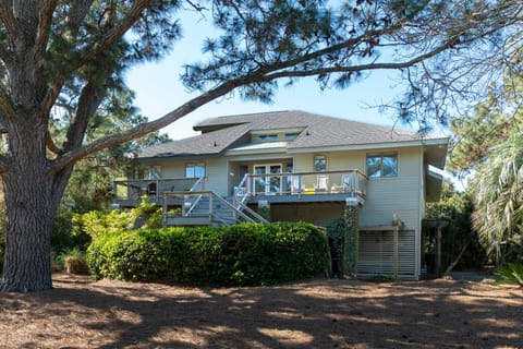 Welcome to 3639 Pompano Court. A great house, nestled amongst the trees, with a private boardwalk to the beach