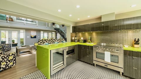 The artistic kitchen sits off the living area with luxury appliances and tools...
