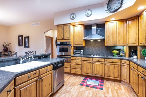Fully equipped kitchen, carafe style coffee pot, gas cook top, and a gas grill right outside make this kitchen a dream to entertain in.