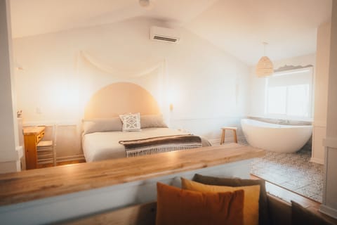 Slip into a deep soaking tub for two, surrounded by forest views