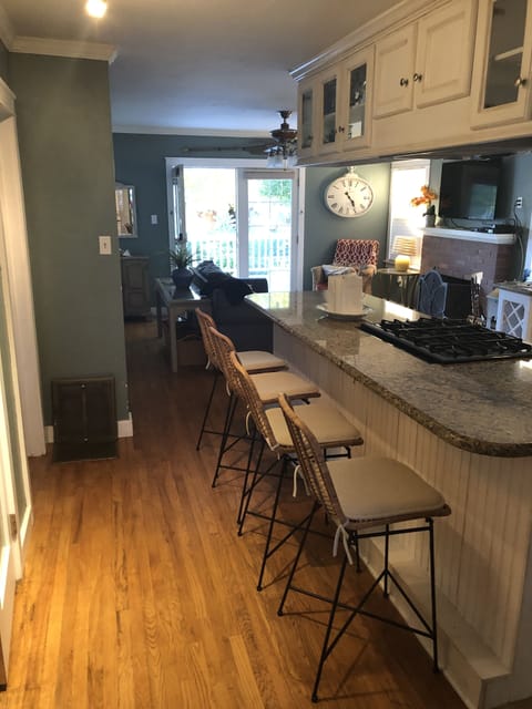4 stools seated around kitchen island