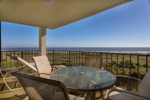 Elevated views and direct boardwalk access nearby keep the beach experience front and center without leaving your rental.