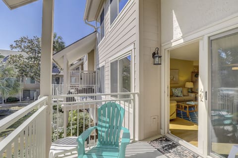The private patio extends your living space outdoors, offering a comfortable spot for dining, morning coffee, or relaxing after a day at the beach.