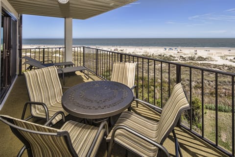 The setting is perfect for enjoying sunrise coffee, afternoon breezes, and the peaceful sound of the waves just beyond the dunes.