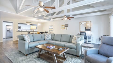This inviting living space features vaulted, beamed ceilings and an open layout that feels light and comfortable from the moment you step in.