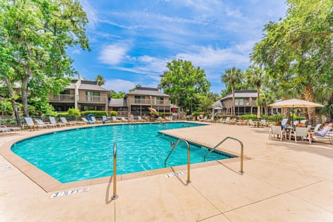 This resort-style pool area offers a vibrant, sun-soaked setting perfect for relaxing and making memories.