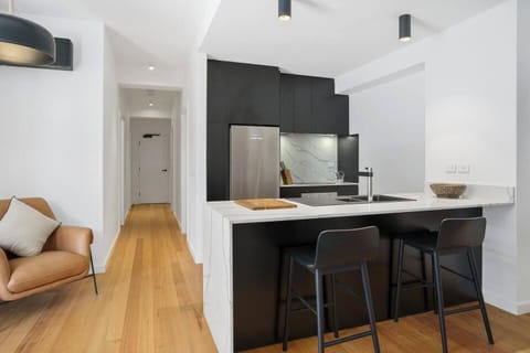 Cook meals in the stunning monochrome kitchen, fully-equipped for your holiday catering.