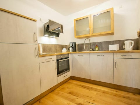 Room, Property, Kitchen, Furniture, Countertop, Cabinetry, Floor, Interior Design, Yellow, Building