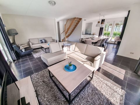 Furniture, Interior Design, Couch, Flooring, Living Room, Floor, Home, Table, Chair, Room