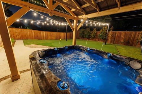 Hot tub under pergola—perfect for evenings.