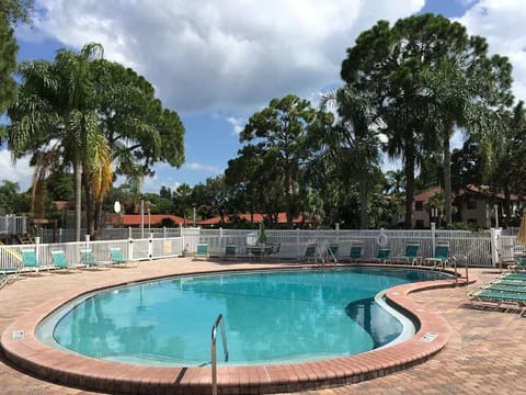 Lounge poolside beneath swaying palms and wide open skies.