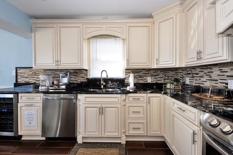 Wine refrigerator at left 