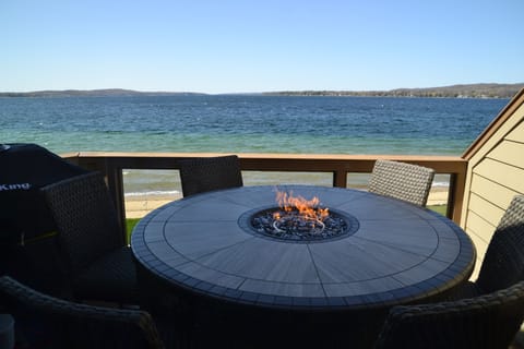Lake view from main floor deck. Fire it dining table. Seats 6.