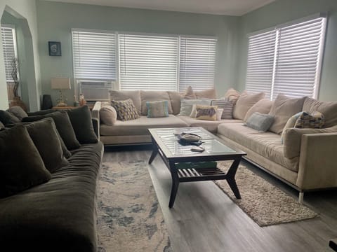 Large living room with oversize couch and chaise sofa