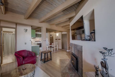 Enjoy relaxing after a day on the mountain in the living room next to the crackling fire with your favorite movie playing