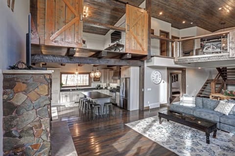 Main floor living area looking towards the kitchen area and loft