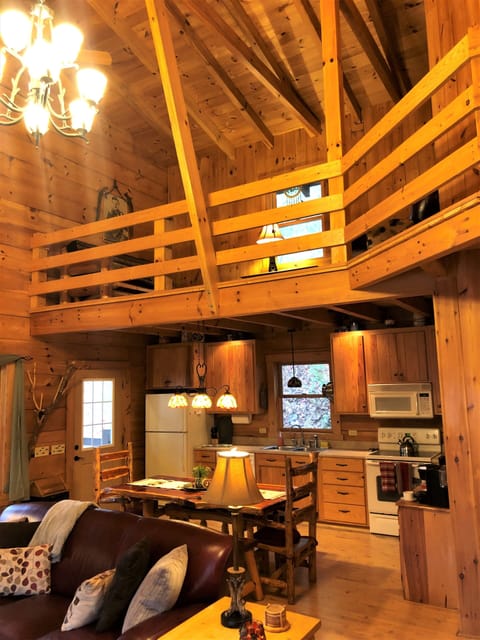 Your open concept great room w/ soaring 22 foot high cathedral beamed ceiling.