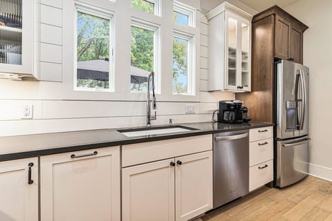 36" undermount sink with Kohler Purist faucet overlooking deck, yard, and marina