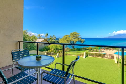 Start your day on the lanai with coffee and ocean views—where every breeze whispers tropical calm    