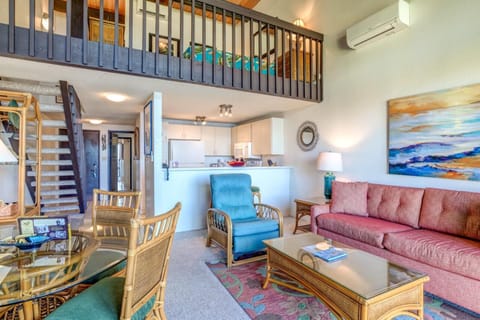 From coral-toned seating to soft tropical rugs, every detail here is curated for breezy, barefoot luxury