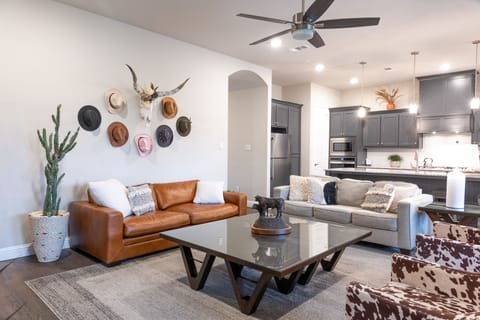 Spacious living room with comfortable seating where everyone can relax together.