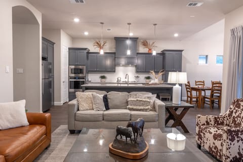 Plenty of gathering space near fully stocked kitchen