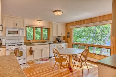 Large fully stocked kitchen with eating area.